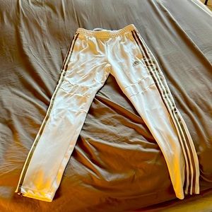 White and gold adidas pants